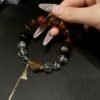 hc-0897-6ca3dfee8c51982df9fb882fedd468ed.jpg Black Gold Rutile Double-Point Bracelet NO. 0897