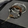 hc-0897-a34d2e7efca62e37c3c3fa15d32ae39a.jpg Black Gold Rutile Double-Point Bracelet NO. 0897